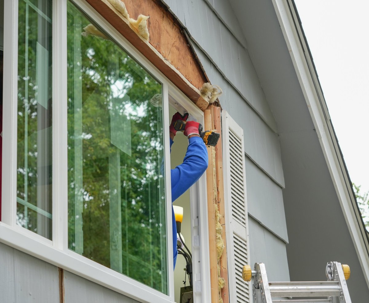 Contractor working on replacing the window of a house