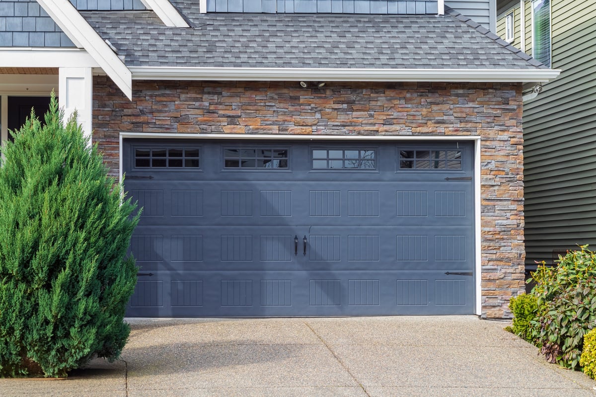 House with blue garage door with windows in Vancouver luxury residential garage