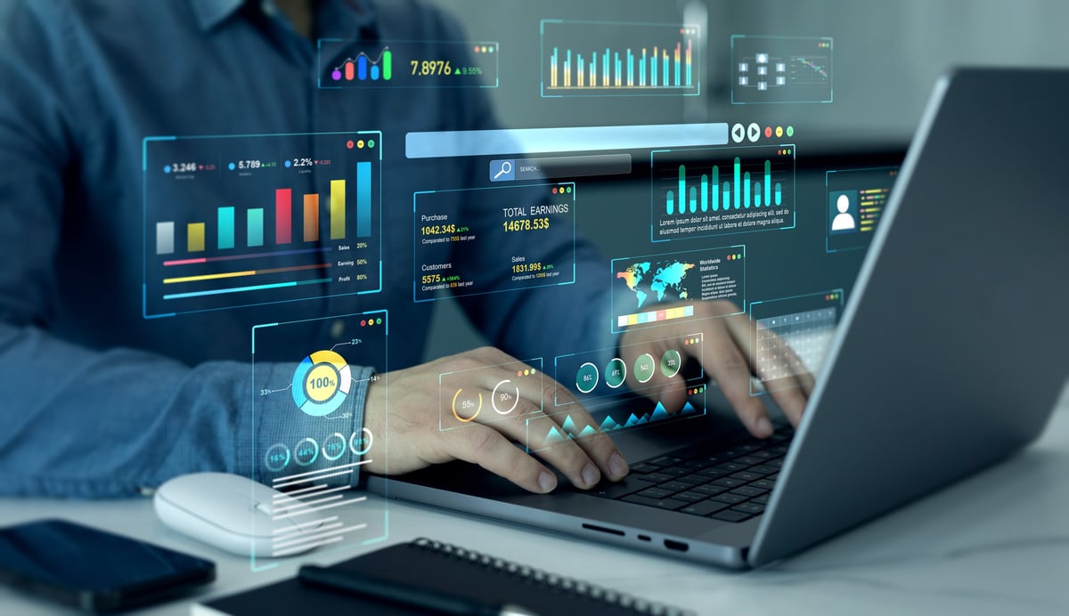 Businessman using a KPI dashboard with business data analytics graphs and management system