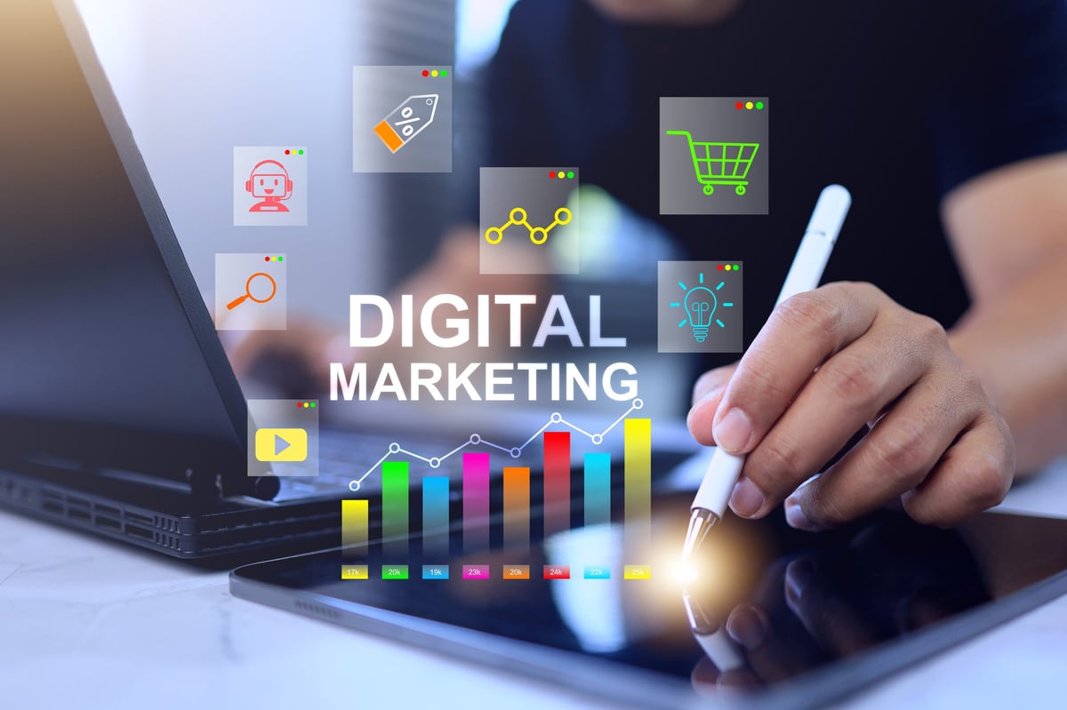 Digital marketing concept with man working on tablet